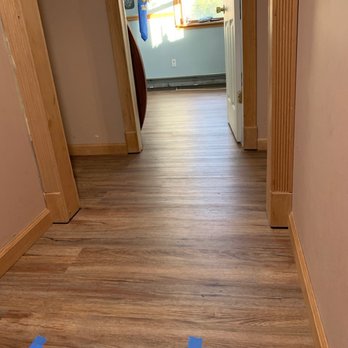 Class Carpet Floor & Home - a hallway with blue tape - Flooring Near Me - Levittown, New York Class Carpet Floor & Home - a hallway with blue tape - Flooring Near Me - Levittown, New York