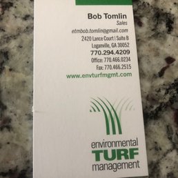 a business card on a granite countertop