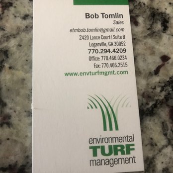 Environmental Turf Management - a business card on a granite countertop - Landscaping Near Me - Loganville, Georgia