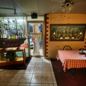 Italian Touch - Decor and partial view of large party table - Italian Near Me - St. Petersburg, Florida Italian Touch - Decor and partial view of large party table - Italian Near Me - St. Petersburg, Florida