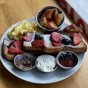 MIAM Cafe - French toast with a side of bacon. Ordered eggs soft scrambled and they came out hard scrambled. - Sandwiches Near Me - Miami, Florida