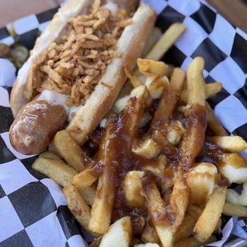 Rhein Haus - The cheese habanero bratwurst with loaded fries (upgrade). - German Near Me - Leavenworth, Washington Rhein Haus - The cheese habanero bratwurst with loaded fries (upgrade). - German Near Me - Leavenworth, Washington