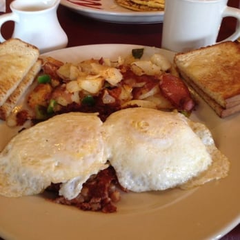 Javier's Café - 2 eggs over medium, corned beef hash, home fries, and white toast. - Breakfast & Brunch Near Me - Smithtown, New York Javier's Café - 2 eggs over medium, corned beef hash, home fries, and white toast. - Breakfast & Brunch Near Me - Smithtown, New York
