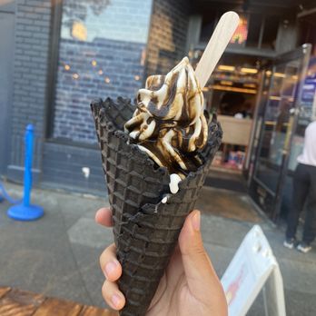 Indigo Cow - Small Hokkaido milk ice cream in cone with hojicha sauce. - Ice Cream & Frozen Yogurt Near Me - Seattle, Washington