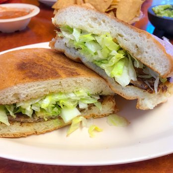 El Caporal - Looks thin, but this torta de milanesa is so good! - Mexican Near Me - Altadena, California
