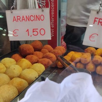 Di Matteo - The deep fried round one is stuffed with meat and cheese and wrapped by a layer of rice. - Italian Near Me - Naples, NA Di Matteo - The deep fried round one is stuffed with meat and cheese and wrapped by a layer of rice. - Italian Near Me - Naples, NA