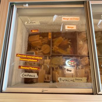 Paleta Paradise - a person standing in front of a display case of pastries - Ice Cream & Frozen Yogurt Near Me - Santa Fe, New Mexico Paleta Paradise - a person standing in front of a display case of pastries - Ice Cream & Frozen Yogurt Near Me - Santa Fe, New Mexico