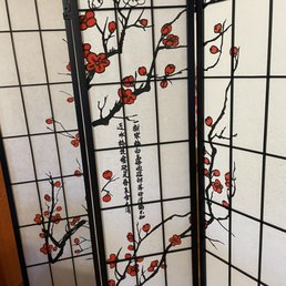 a room divider with a cherry tree