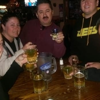 Horseshoe Lounge - a group of people drinking beer - Pool Halls Near Me - Riverside, California