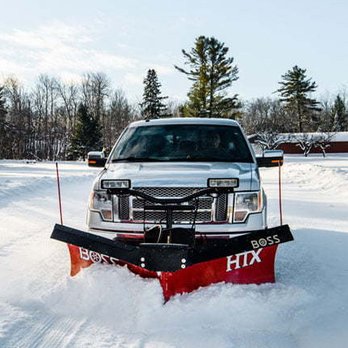 Bozeman Site Services - a snow plow in the snow - Snow Removal Near Me - Belgrade, Montana