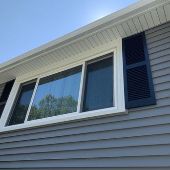 A&A Services Home Improvement - Front window showing the new siding shutters, soffit, and gutter/downspout. - General Contractors Near Me - Salem, Massachusetts A&A Services Home Improvement - Front window showing the new siding shutters, soffit, and gutter/downspout. - General Contractors Near Me - Salem, Massachusetts
