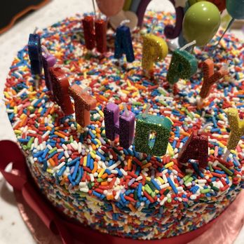 Sugarlips Cakery - We added the happy birthday topper. This is a rainbow sprinkle cake and they supplied the bow. - Bakeries Near Me - Mesa, Arizona Sugarlips Cakery - We added the happy birthday topper. This is a rainbow sprinkle cake and they supplied the bow. - Bakeries Near Me - Mesa, Arizona