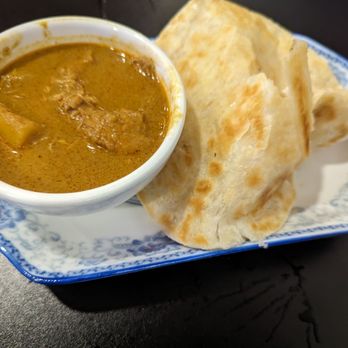 Makan House - Roti Paratha (Wheat Pancake) crispy and fluffy wheat flour pancake with curry beef potato sauce. - Malaysian Near Me - Brooklyn, New York Makan House - Roti Paratha (Wheat Pancake) crispy and fluffy wheat flour pancake with curry beef potato sauce. - Malaysian Near Me - Brooklyn, New York