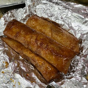 BTR Pinoy Restaurant - two pieces of pork wrapped in tin foil - Asian Fusion Near Me - Long Beach, California