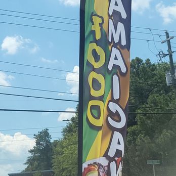 4 Seasons Jerk Center - Flags outside of entrance to the restaurant - Caribbean Near Me - Augusta, Georgia