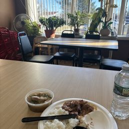 a plate of food and a bottle of water a plate of food and a bottle of water