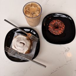 Cinnamon roll, classic doughnut with chocolate sprinkles, iced latte with house made hazelnut syrup Cinnamon roll, classic doughnut with chocolate sprinkles, iced latte with house made hazelnut syrup