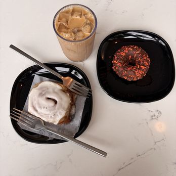 Rise Authentic Baking Co - Cinnamon roll, classic doughnut with chocolate sprinkles, iced latte with house made hazelnut syrup - Bakeries Near Me - Grand Rapids, Michigan Rise Authentic Baking Co - Cinnamon roll, classic doughnut with chocolate sprinkles, iced latte with house made hazelnut syrup - Bakeries Near Me - Grand Rapids, Michigan
