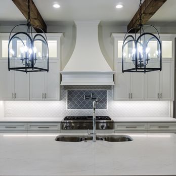 Bastrop Flooring & Granite - a kitchen with white cabinets and a large island - Countertop Installation Near Me - Bastrop, Texas Bastrop Flooring & Granite - a kitchen with white cabinets and a large island - Countertop Installation Near Me - Bastrop, Texas