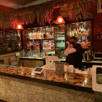 Hukilau - a man and a woman at a bar - Hawaiian Near Me - San Jose, California Hukilau - a man and a woman at a bar - Hawaiian Near Me - San Jose, California