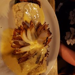 Rio Grande - Grilled stuffed burrito with steak, chicken, shrimp, onions, green peppers topped with cheese and grilled blooming onion