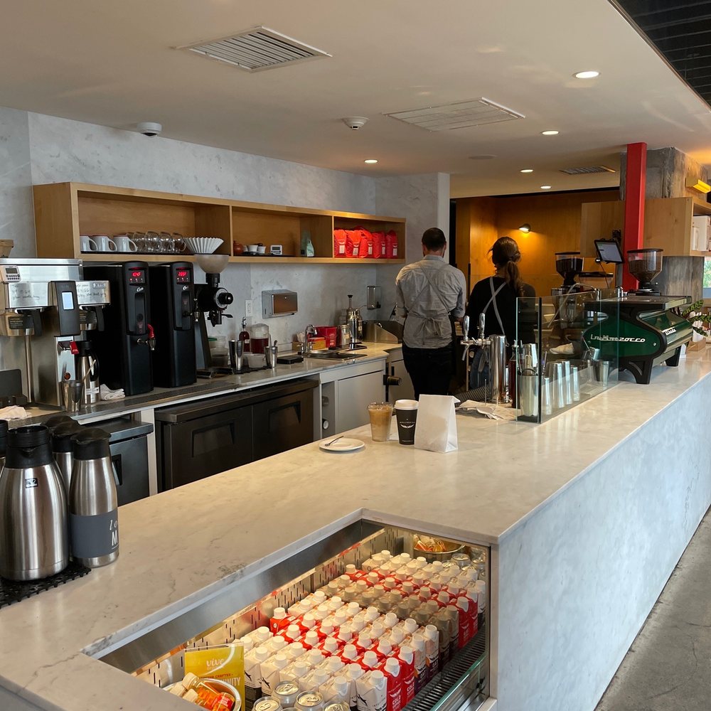 Intelligentsia Coffee - a man standing at the counter - Coffee & Tea Near Me - Watertown, Massachusetts Intelligentsia Coffee - a man standing at the counter - Coffee & Tea Near Me - Watertown, Massachusetts