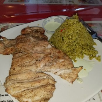 Pollito Con Papas - Thus was the #1, 2 grilled boneless, skinless chicken thighs with cilantro rice and Aji. YUM - Peruvian Near Me - Albuquerque, New Mexico