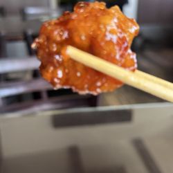 China Wok Express - Orange chicken - balanced flavor and light coating of flour and sweet sauce.  Still crunchy!