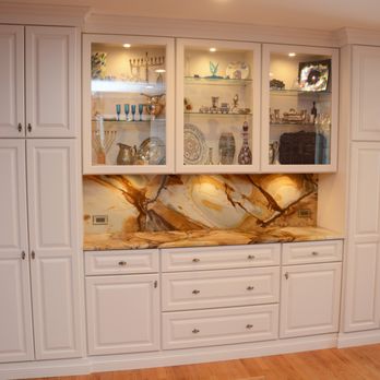 Cabinet Discounters- Chantilly -  a kitchen with white cabinets and a marble countertop - Cabinetry Near Me - Chantilly, Virginia