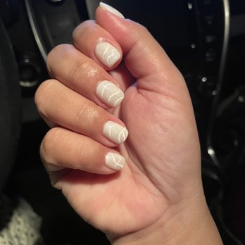 MJ Nails Spa - Had to go extra short (to me) this time bc of work. But awesome job by Jay! Simple white on white with a little freehand. thank you!! - Nail Salons Near Me - Henderson, Nevada MJ Nails Spa - Had to go extra short (to me) this time bc of work. But awesome job by Jay! Simple white on white with a little freehand. thank you!! - Nail Salons Near Me - Henderson, Nevada