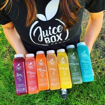 Juice Box Fargo - a woman holding six bottles of juice - Juice Bars & Smoothies Near Me - West Fargo, North Dakota Juice Box Fargo - a woman holding six bottles of juice - Juice Bars & Smoothies Near Me - West Fargo, North Dakota