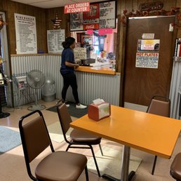 a woman standing at the counter
