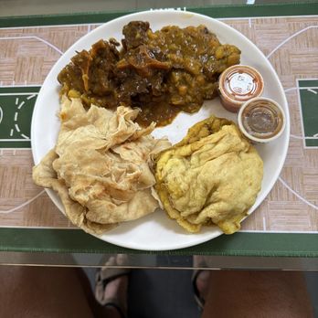 Teddy's Roti Shop - Oxtail bus up roti with Chana and potato's - Trinidadian Near Me - Washington, DC, District of Columbia Teddy's Roti Shop - Oxtail bus up roti with Chana and potato's - Trinidadian Near Me - Washington, DC, District of Columbia