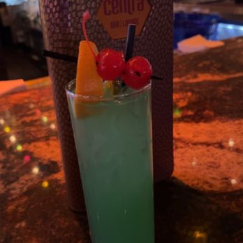 Centra - a blue drink with a garnish garnish - Lounges Near Me - Las Vegas, Nevada