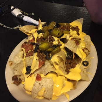 Charmont Lanes - a plate of nachos with cheese and olives - American Near Me - Cass City, Michigan