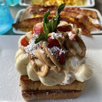 Untoasted - You see the Dulce de Leche with strawberries added. Yummmmmm. The drinks are Blue Hawaiians. Love love love!!! - Breakfast & Brunch Near Me - Hallandale Beach, Florida Untoasted - You see the Dulce de Leche with strawberries added. Yummmmmm. The drinks are Blue Hawaiians. Love love love!!! - Breakfast & Brunch Near Me - Hallandale Beach, Florida