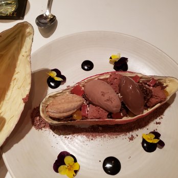 Xochi - Inside of Cacao dessert (chocolate cocoa pod, chocolate textures- tejate foam, milk chocolate cloud, chocolate criollo soil) - Mexican Near Me - Houston, Texas Xochi - Inside of Cacao dessert (chocolate cocoa pod, chocolate textures- tejate foam, milk chocolate cloud, chocolate criollo soil) - Mexican Near Me - Houston, Texas