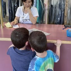 Fashion Care Master Dry Cleaners - Twin 5-year-old brothers with a repaired elephant lovie.