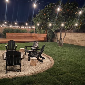 Romero trees and landscape - a fire pit in a backyard - Tree Services Near Me Romero trees and landscape - a fire pit in a backyard - Tree Services Near Me