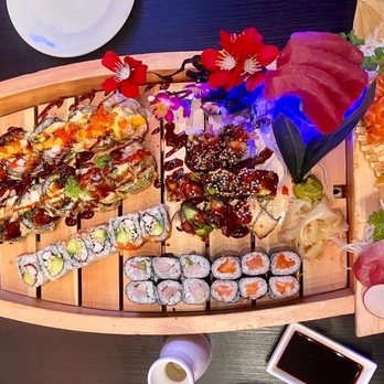 Mika Sushi 5 - a variety of sushi on a boat - Sushi Bars Near Me - Denver, Colorado Mika Sushi 5 - a variety of sushi on a boat - Sushi Bars Near Me - Denver, Colorado