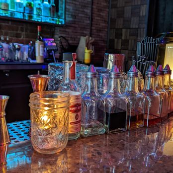 Tipsea - a bar with a lot of bottles and glasses - Cocktail Bars Near Me - Berkeley, California
