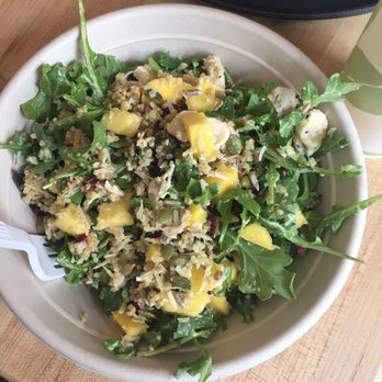 Greenbeat - Mango dressing with mango chunks, arugula, cranberries, quinoa, Parmesan cheese, and seeds! - Salad Near Me - Orlando, Florida Greenbeat - Mango dressing with mango chunks, arugula, cranberries, quinoa, Parmesan cheese, and seeds! - Salad Near Me - Orlando, Florida