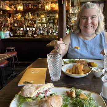Pickerel Inn - Girlfriend enjoying amazing fish cakes and chips - Pubs Near Me - Cambridge, CAM