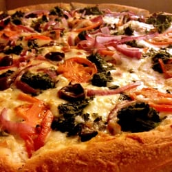 Bella Pizza Pub - The Grecian  - Sooooo good!   It took an hour to get the pizza but it was worth the wait.