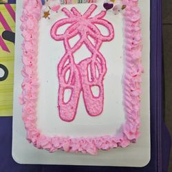 There are 24 cupcakes underneath this! The frosting on top was light, fluffy, and delicious!