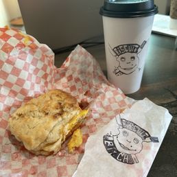Bacon, egg, and cheese biscuit with delicious coffee. Bacon, egg, and cheese biscuit with delicious coffee.