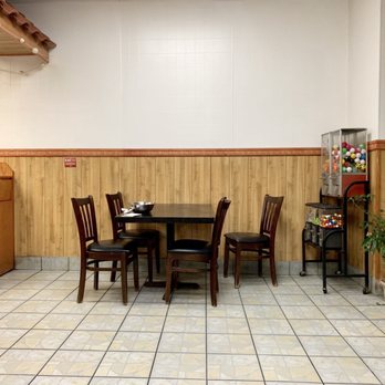 Ming Moon - a table and chairs in a restaurant - Chinese Near Me - Wethersfield, Connecticut