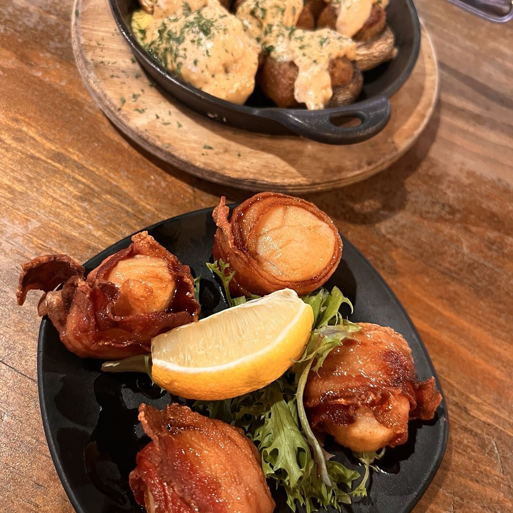 Riverhouse - Scallops wrapped in bacon. Stuffed mushrooms - New American Near Me - Taunton, Massachusetts Riverhouse - Scallops wrapped in bacon. Stuffed mushrooms - New American Near Me - Taunton, Massachusetts