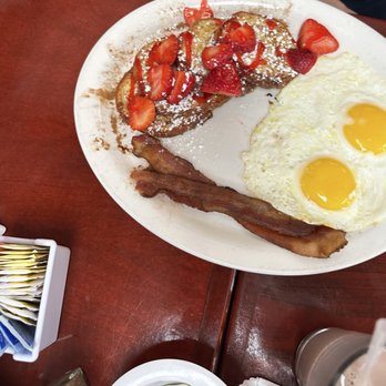 Exquisite Skillet Pancake House - Strawberry Cinnamon Swirl French Toast with sunny side eggs and bacon - Breakfast & Brunch Near Me - Aurora, Illinois Exquisite Skillet Pancake House - Strawberry Cinnamon Swirl French Toast with sunny side eggs and bacon - Breakfast & Brunch Near Me - Aurora, Illinois