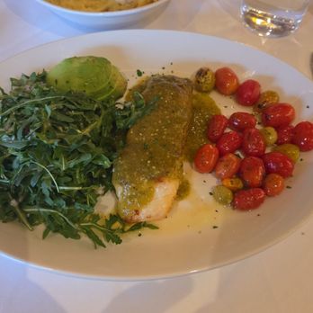 Coppolillos Italian Steakhouse - Chillean sea bass that has a tomatillo salsa then it came with roasted tomatoes, arugula and avocado - Steakhouses Near Me - Crown Point, Indiana